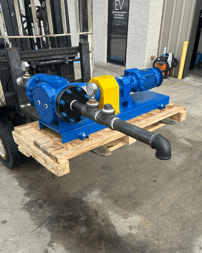 Desmi/Rotan gear pump and electric motor mounted on a blue painted baseplate, built by EV Pump & Equipment to suction-lift drilling mud for Aerion's ARM real-time monitoring system on active drilling rigs.