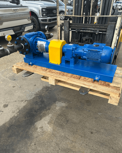 Desmi/Rotan gear pump and electric motor mounted on a blue painted baseplate, built by EV Pump & Equipment to suction-lift drilling mud for Aerion's ARM real-time monitoring system on active drilling rigs.