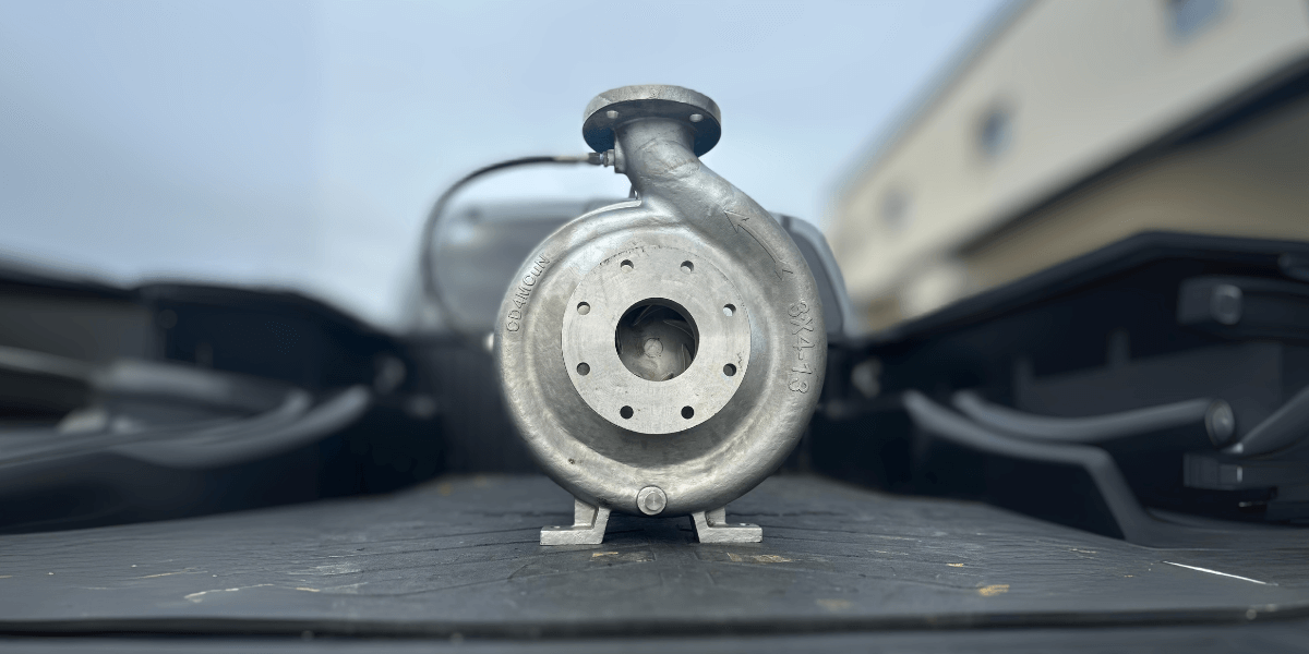 Centrifugal pump made of CD4 material, mounted in the tailgate of a truck, ready to be mated to a 30 HP electrical motor for fluid handling applications.