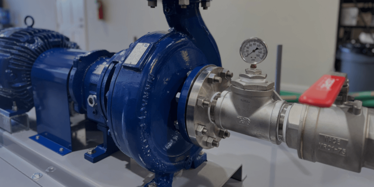 Industrial centrifugal pump rental unit with motor, pressure gauge, and stainless steel piping from EV Pump & Equipment.