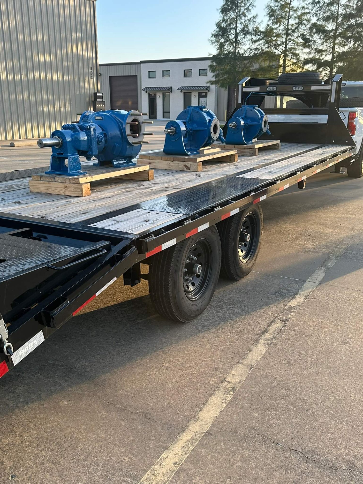 3 Viking Gear Pumps loaded on a flatbed trailer