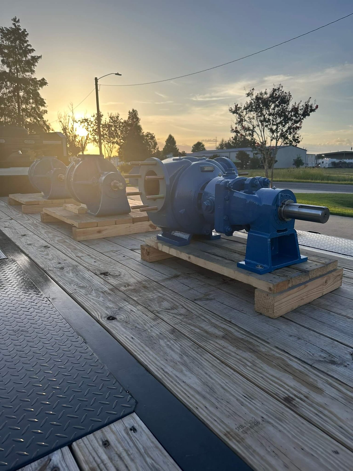 3 Viking Gear Pumps loaded on a flatbed trailer